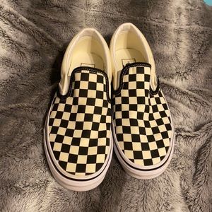 Black and off white checkered slip on vans